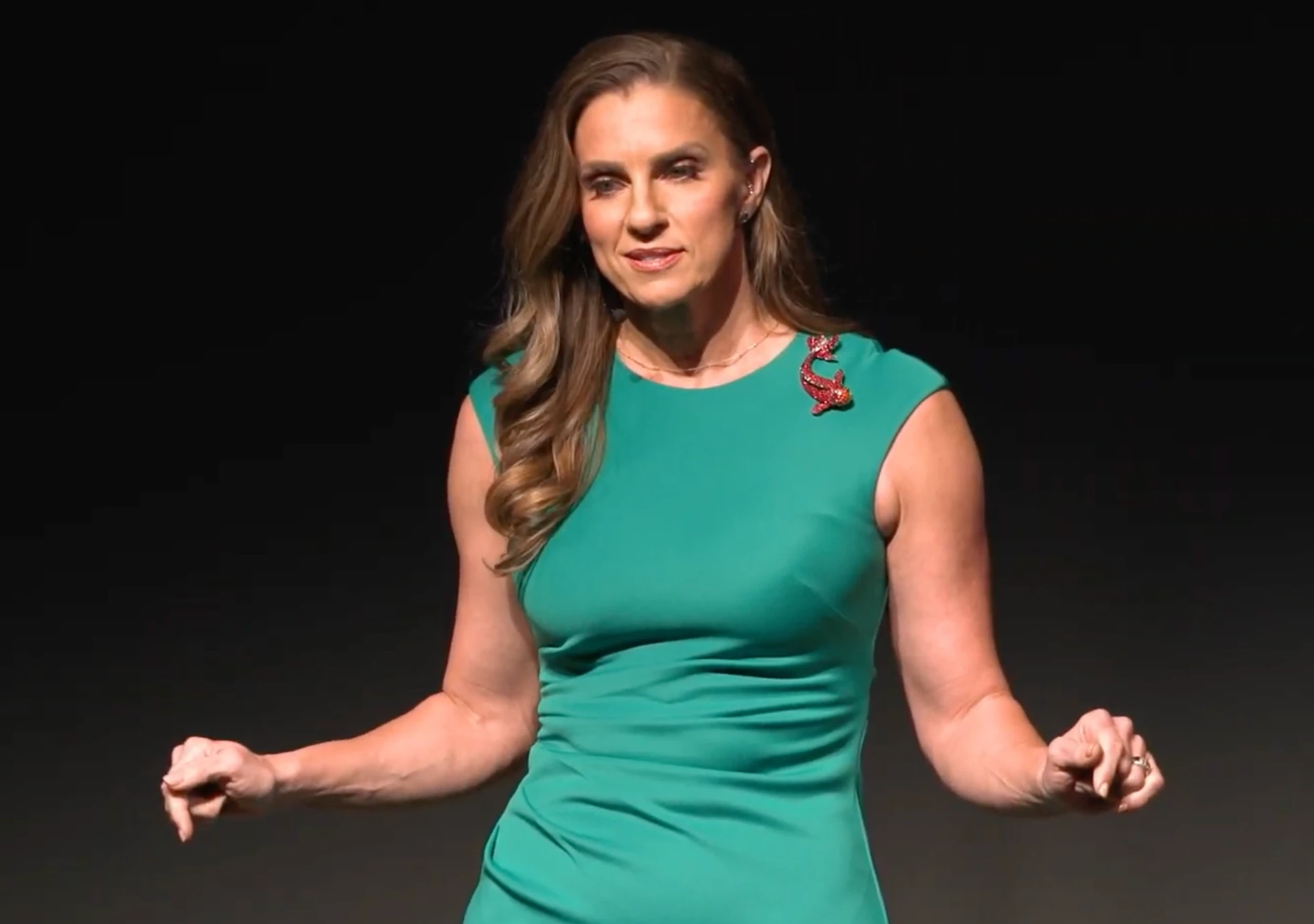 MaryAnne Karstadt gesturing while speaking at the Tempe Center for the Arts