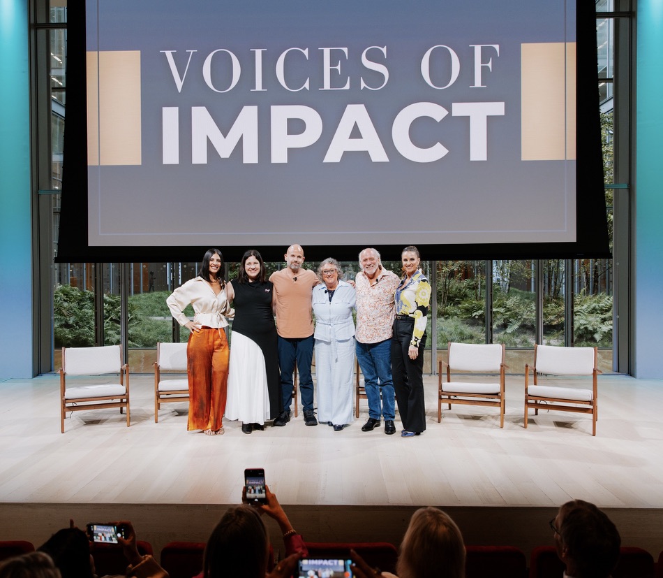 MaryAnne Karstadt on stage with fellow panelists in front of a live audience